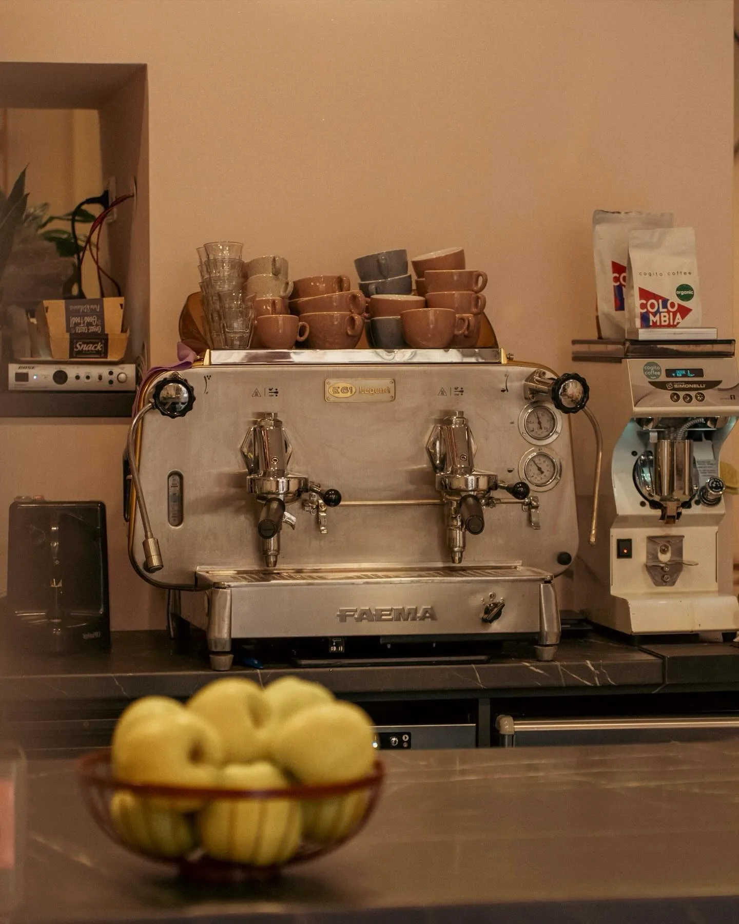 Fyaka espresso machine and cups inside the cafe
